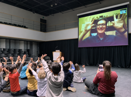 Children's author Kenn Nesbitt performing for a group of students during an online author visit
